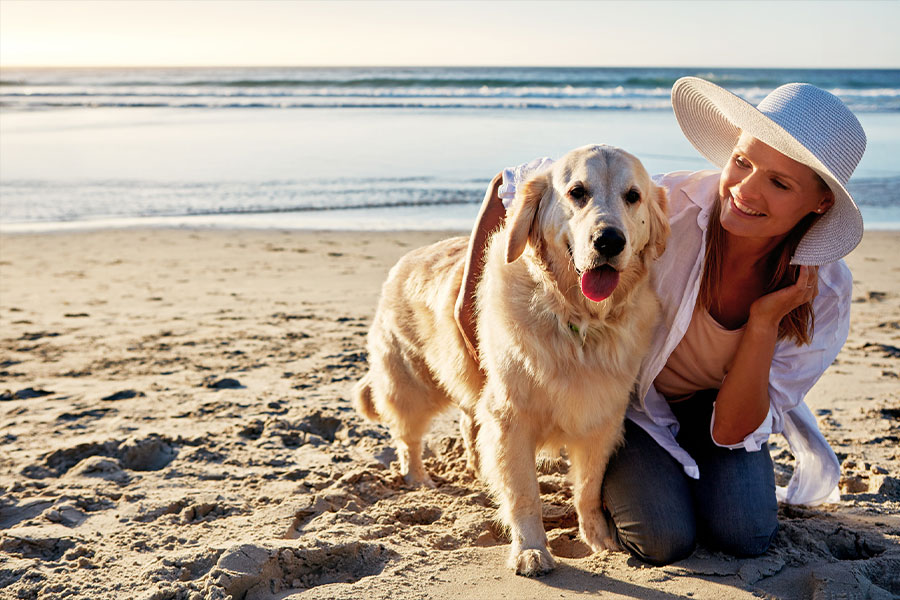 woman and dog on Satellite Beach